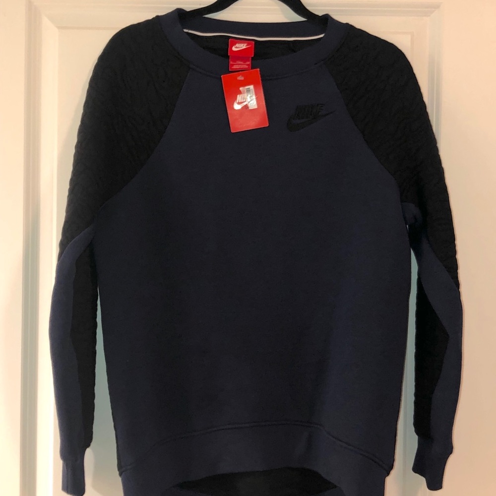 Brand new Nike crew neck with detailed sleeves.